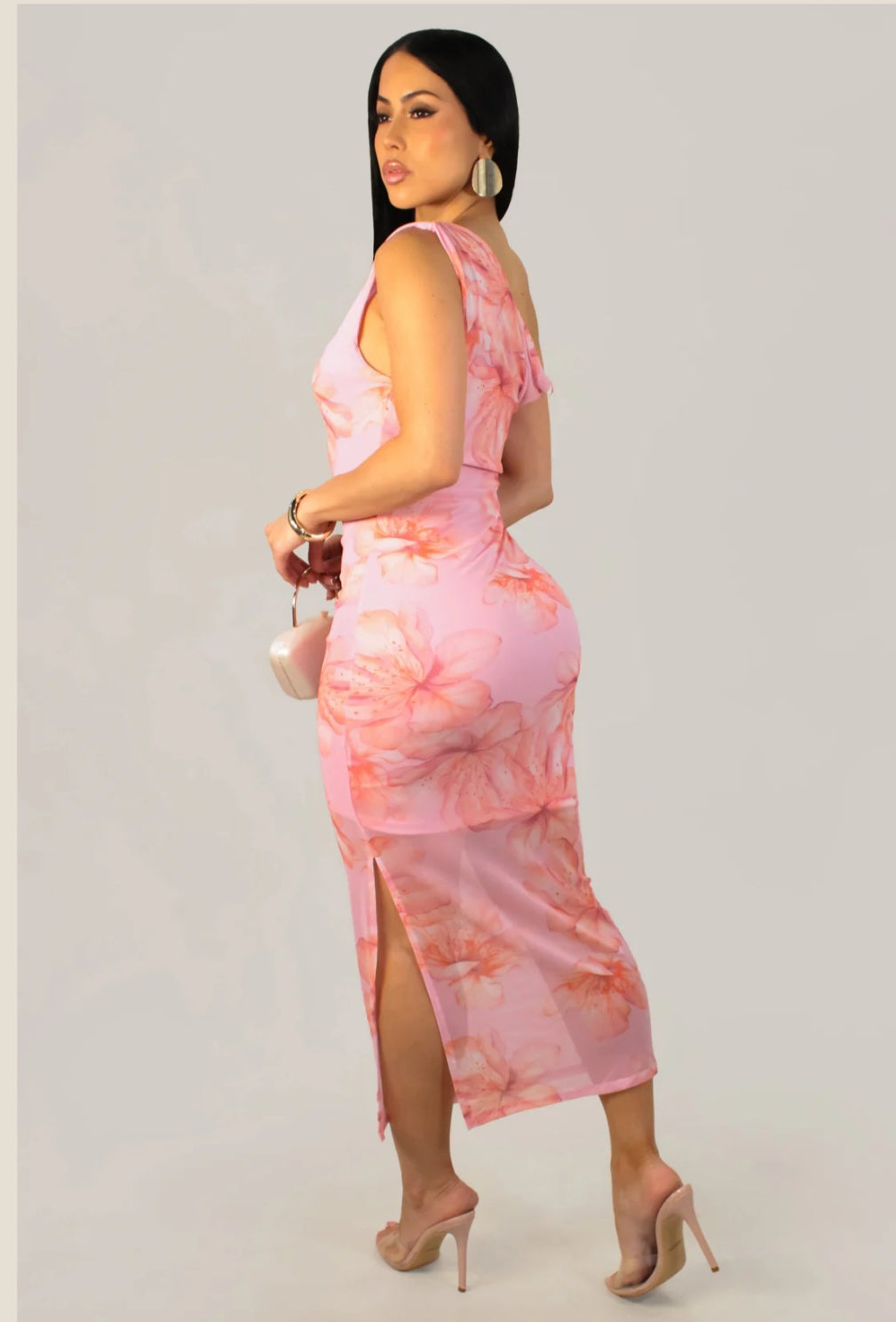 Back and side view of a pink floral bodycon maxi dress showing a side leg slit and curve-hugging silhouette