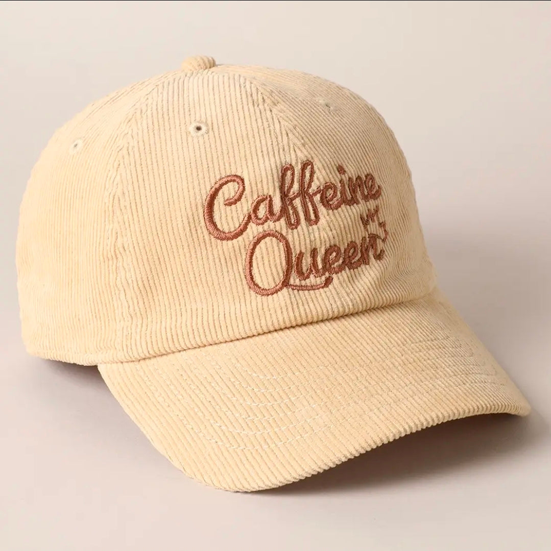 Beige cap with 'Caffeine Queen' embroidery on a beige background