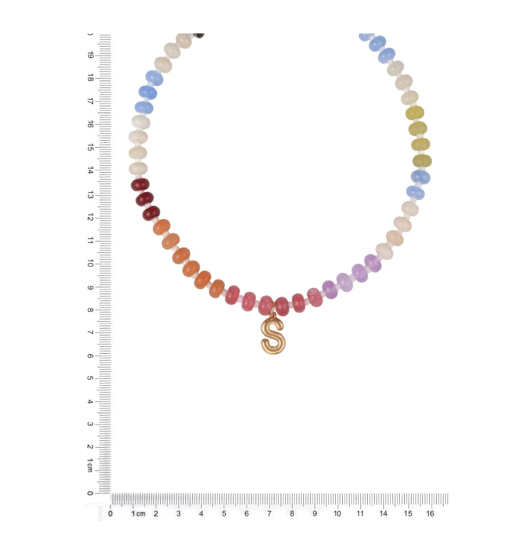 Necklace with multicolored beads and a gold 'S' pendant next to a ruler for size reference.