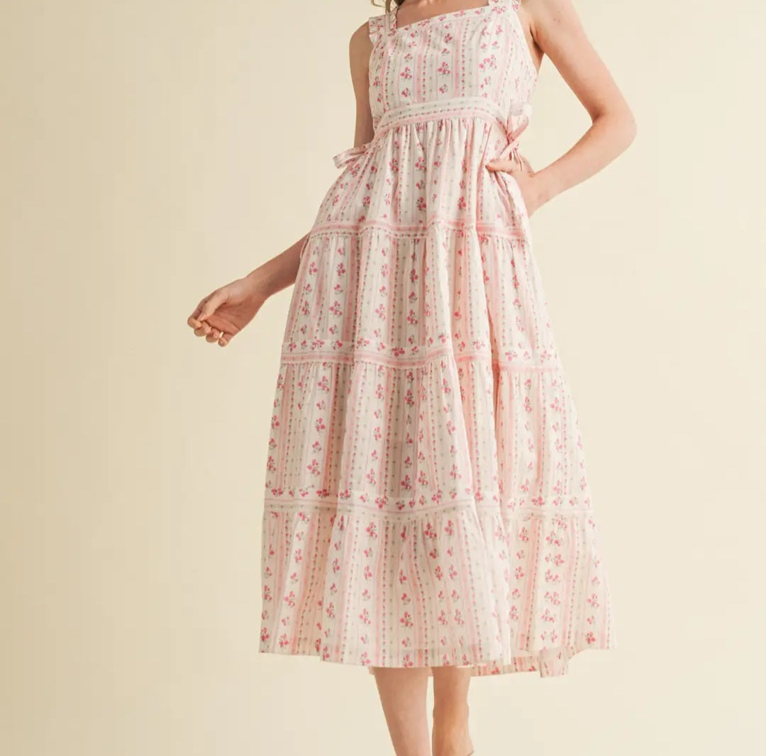 Woman wearing a floral dress on a beige background