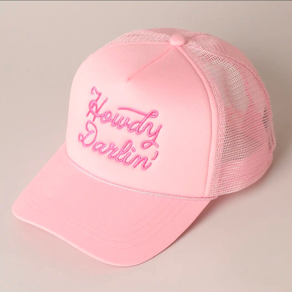 Pink cap with 'Howdy Darlin'' text on a light gray background