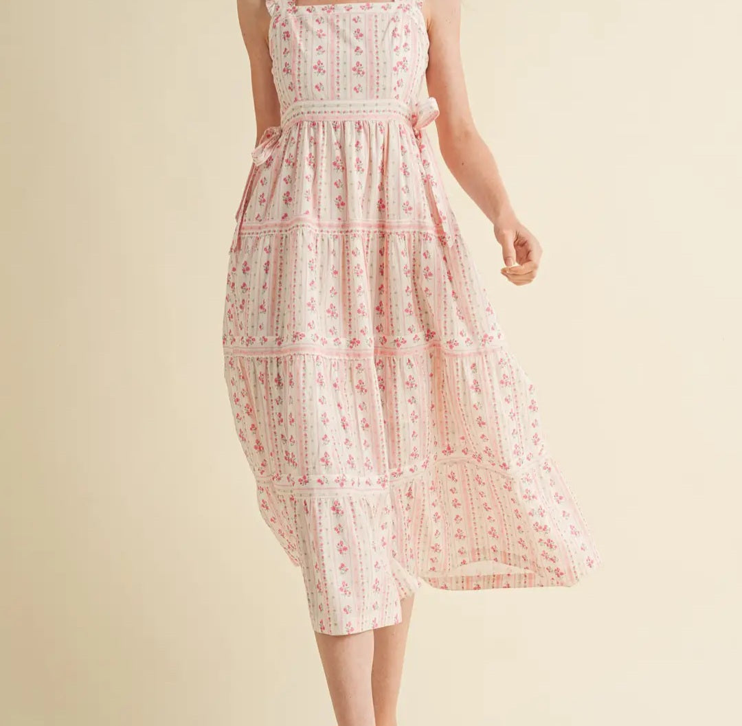 Woman wearing a floral dress on a beige background