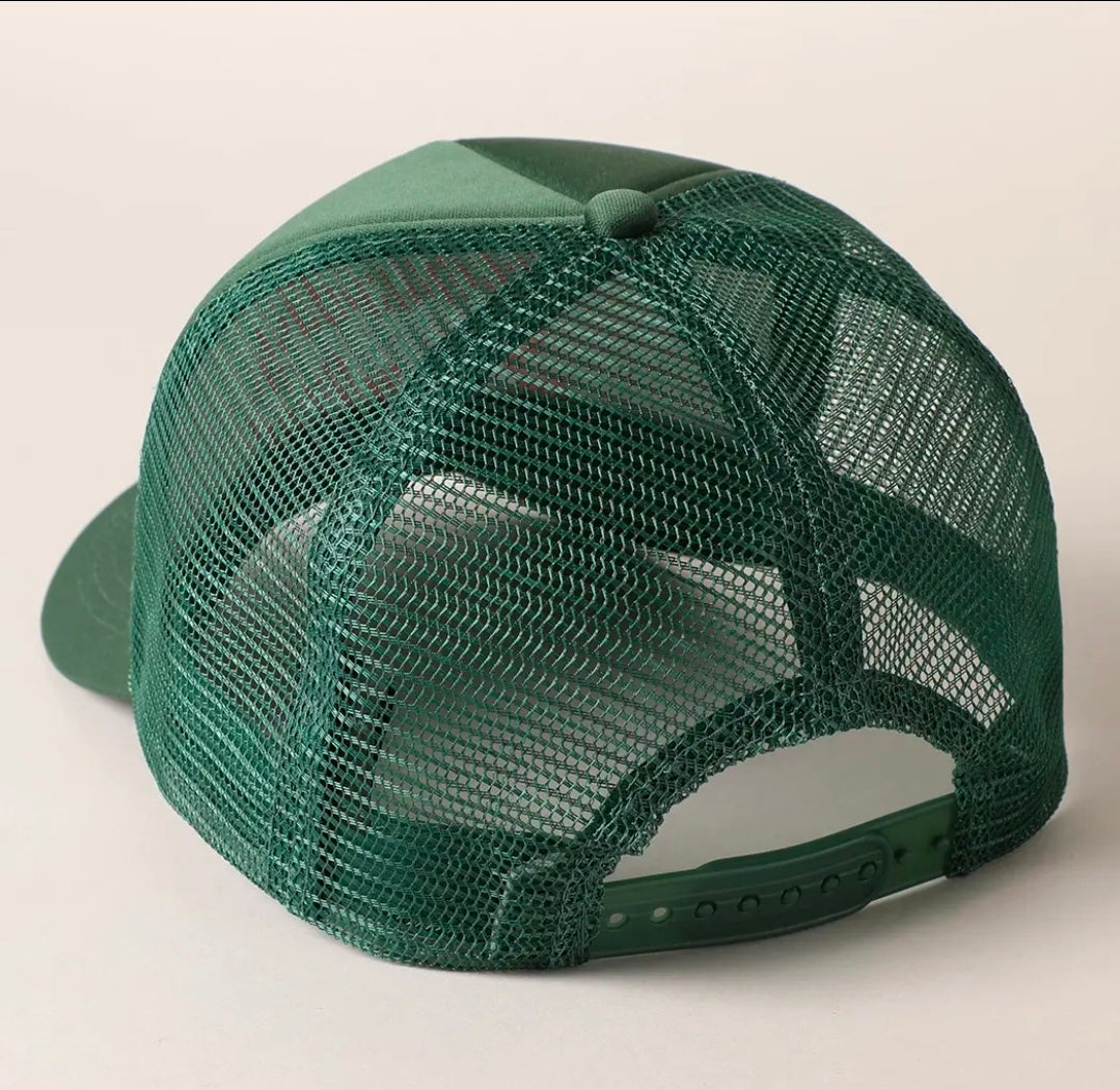 A dark green trucker-style baseball cap shown from the back, featuring a solid green visor and green mesh back panels, photographed against a light off-white background.
