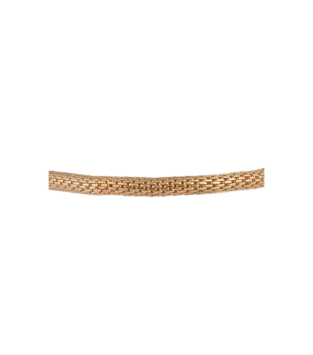Close-up of a gold bracelet on a white background