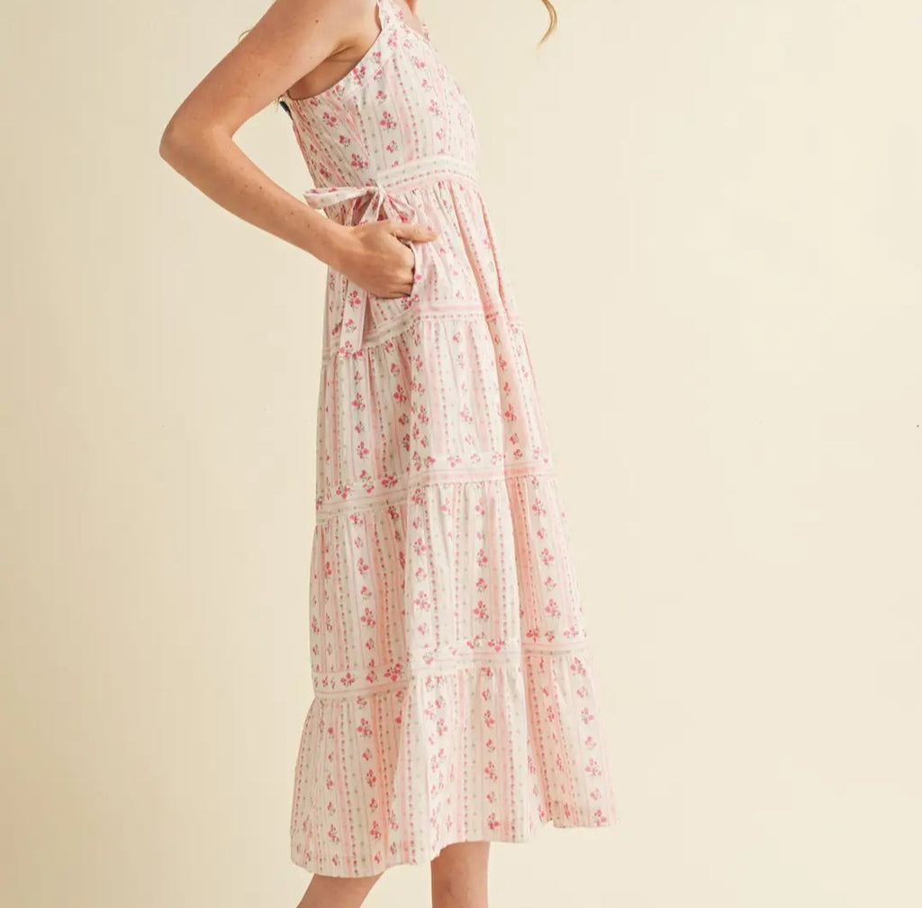 Woman wearing a floral dress on a beige background