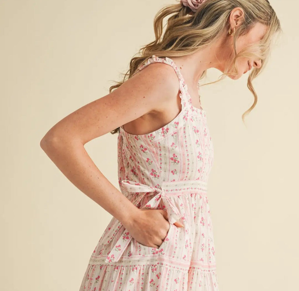 Woman wearing a floral dress against a beige background