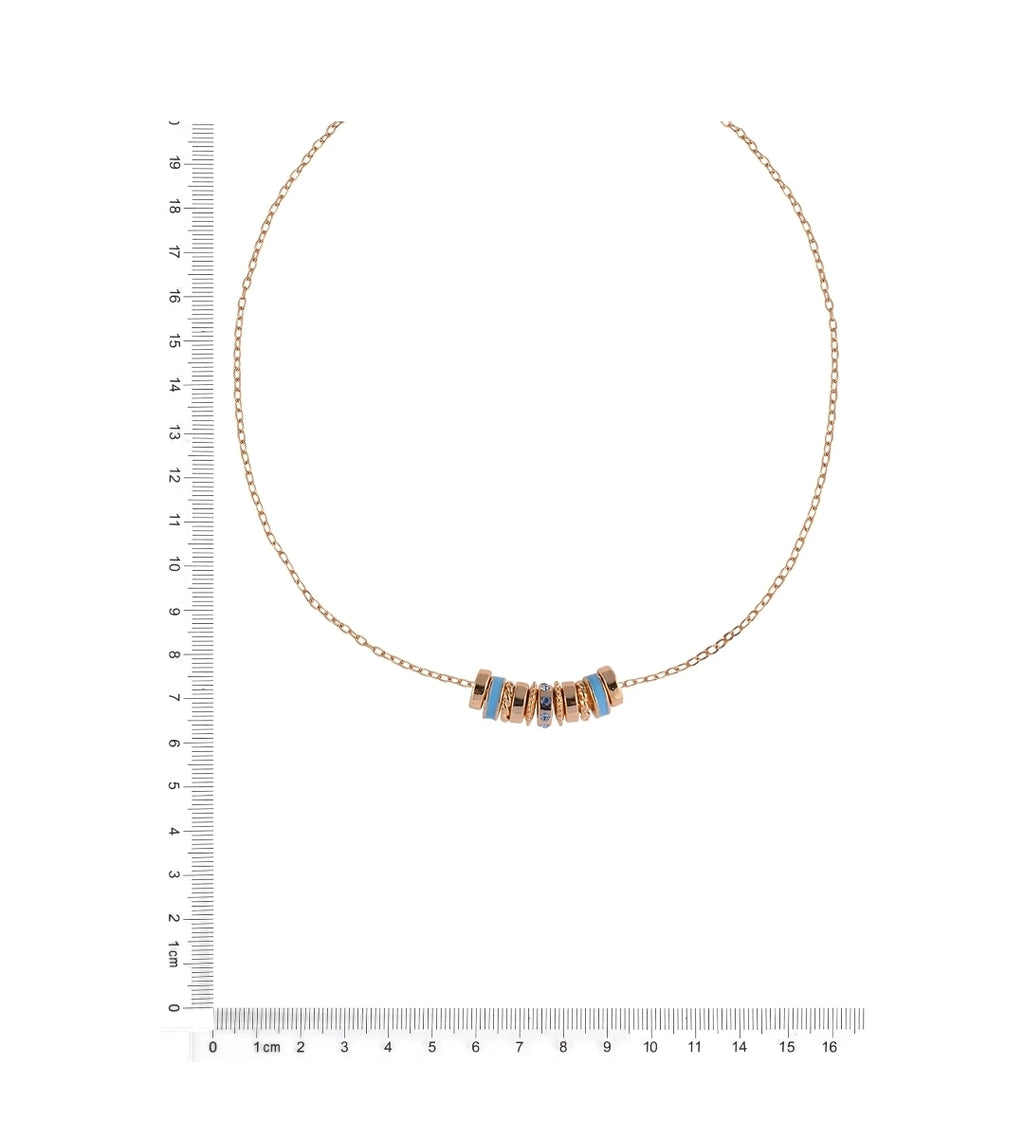 A delicate gold chain necklace with a central cluster of small gold beads, some inlaid with light blue stones, displayed on a white background with a ruler on the left and bottom for scale.