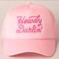 Pink cap with 'Howdy Darlin' text on a light gray background
