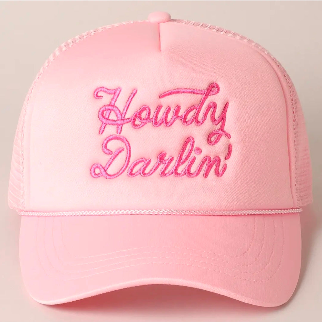 Pink cap with 'Howdy Darlin' text on a light gray background