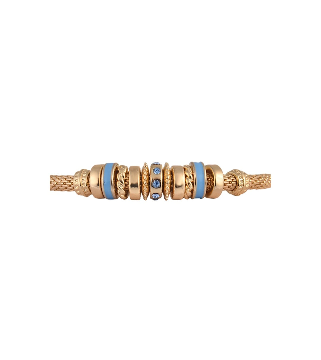 Gold and blue beaded bracelet on a white background