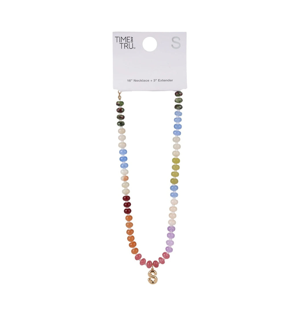 Multicolored beaded necklace on a white background with 'Time & Tru' packaging.