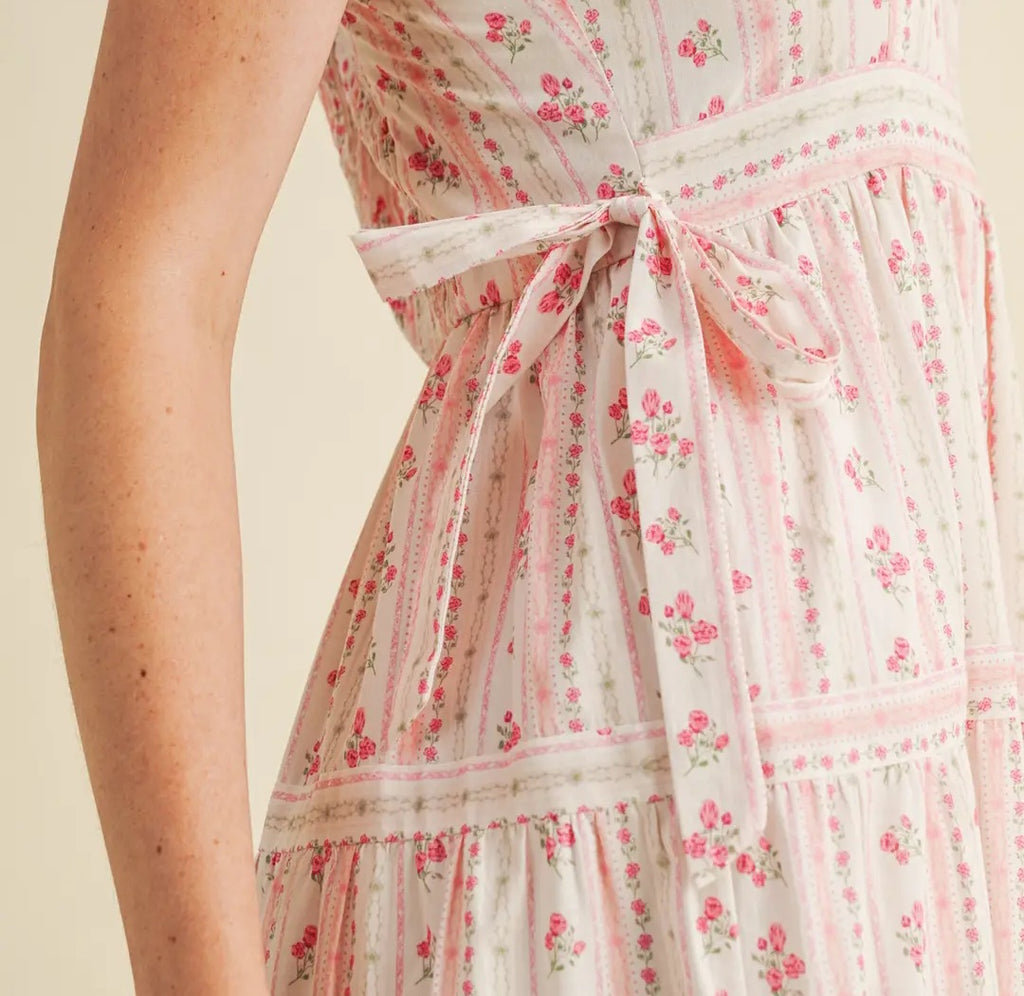 Floral dress with pink flowers on a beige background
