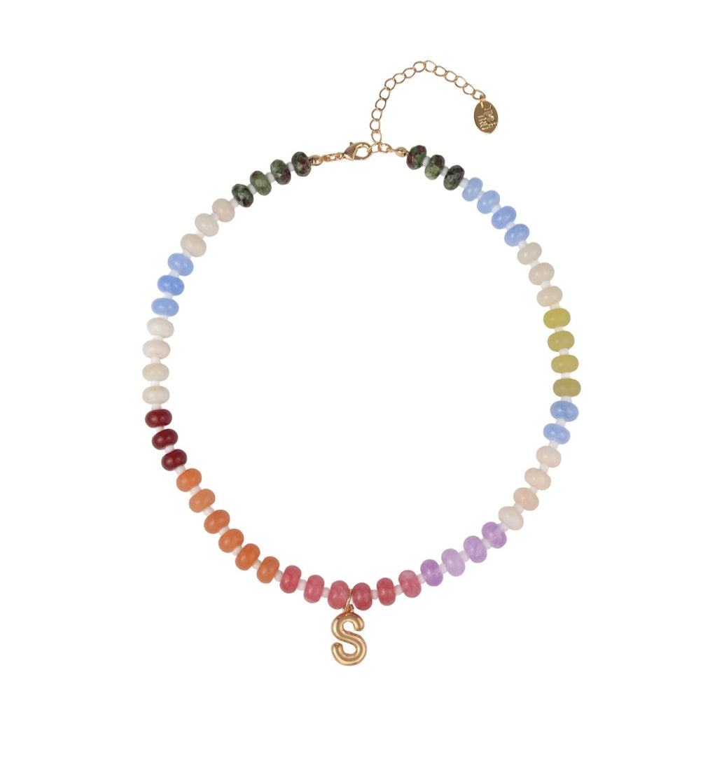 Necklace with multicolored beads and a gold letter 'S' on a white background